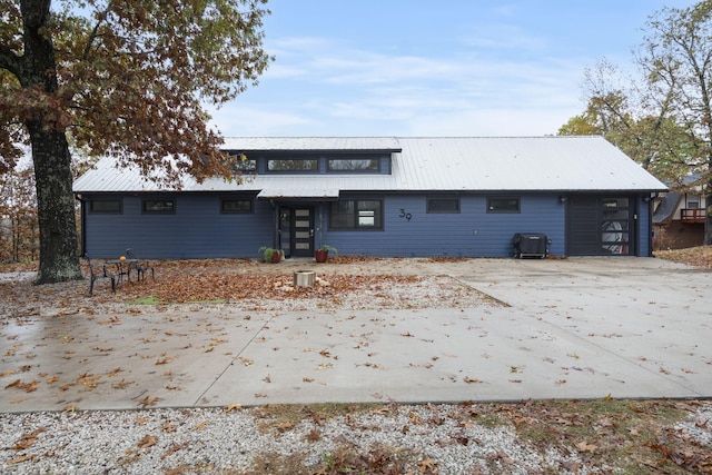 back of property featuring a garage