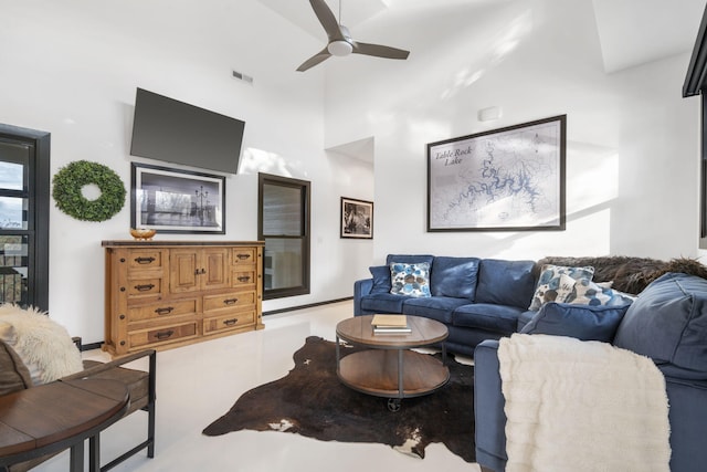 living room featuring high vaulted ceiling and ceiling fan