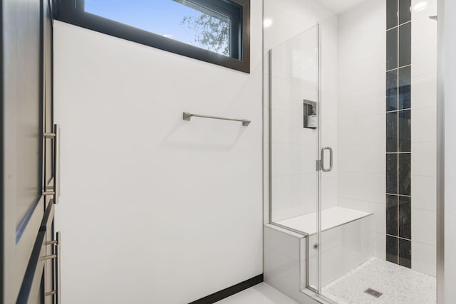 bathroom featuring an enclosed shower