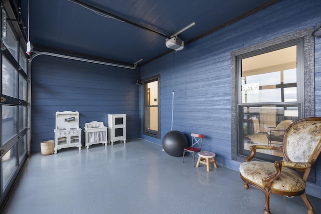 living area featuring wooden walls