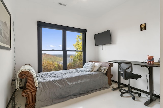 bedroom with concrete floors