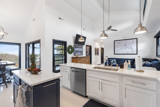 kitchen with dishwasher, decorative light fixtures, high vaulted ceiling, white cabinetry, and sink