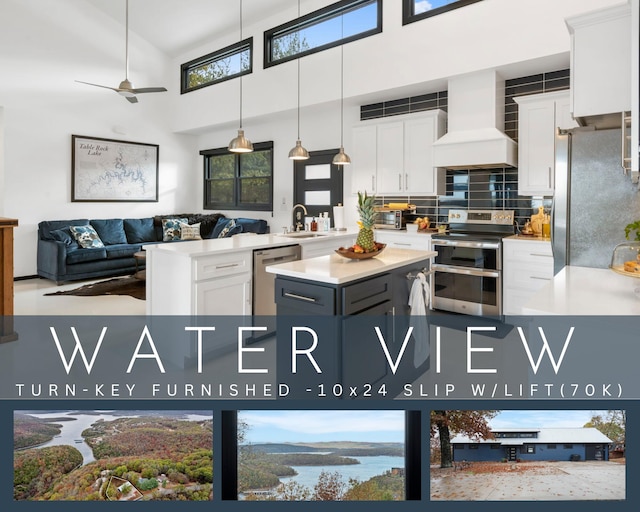 kitchen featuring custom exhaust hood, stainless steel appliances, ceiling fan, white cabinets, and backsplash