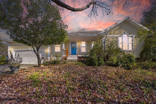 view of front of property with a garage