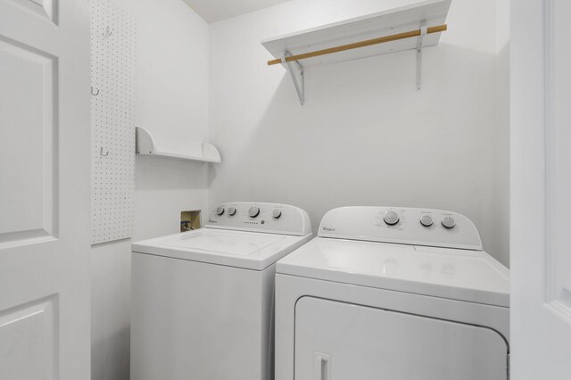 laundry area with washer and dryer