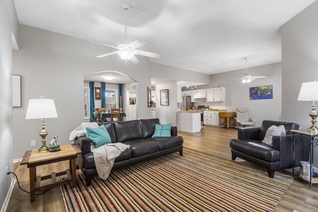 living room with hardwood / wood-style flooring and ceiling fan