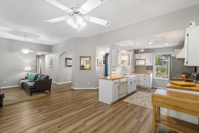 kitchen with white cabinetry, white appliances, hardwood / wood-style flooring, and ceiling fan