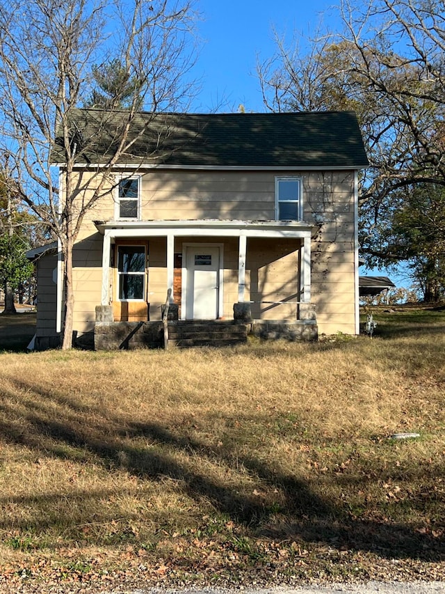 view of front of property with a front lawn