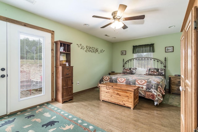 bedroom with light wood-type flooring and ceiling fan