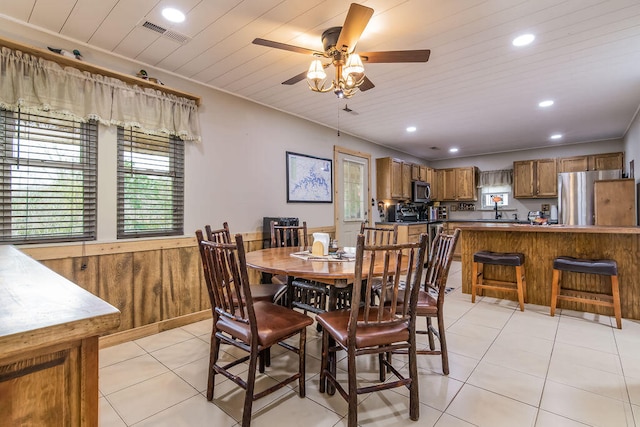 tiled dining room with wooden ceiling and ceiling fan