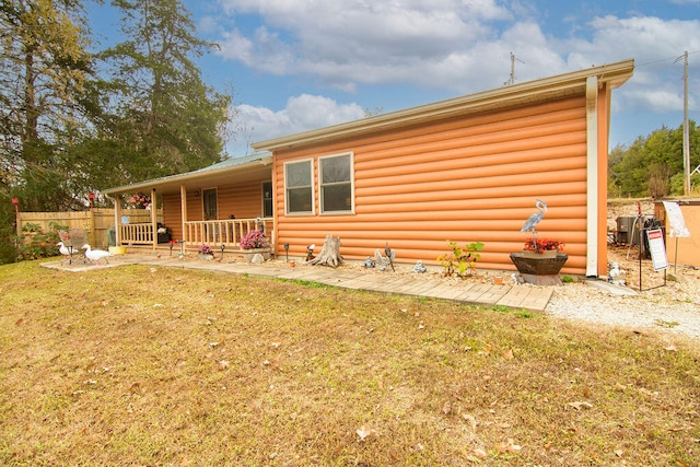 rear view of house with a lawn