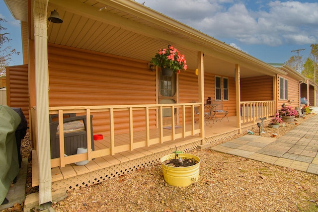 view of property exterior featuring a porch