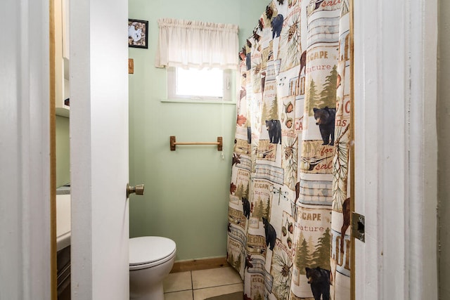 bathroom featuring toilet and tile patterned floors