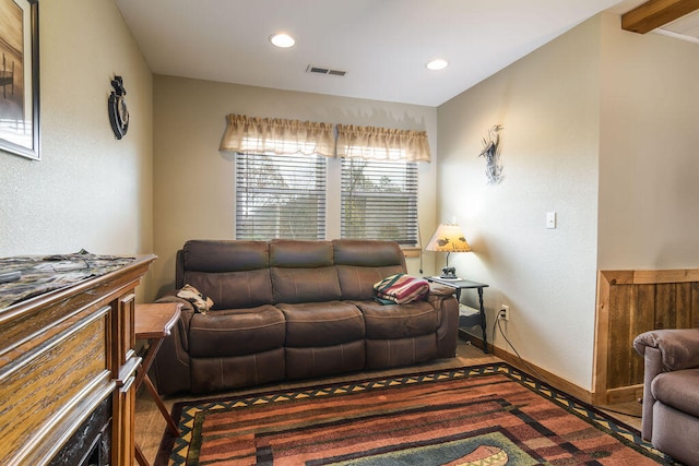 living room with beamed ceiling