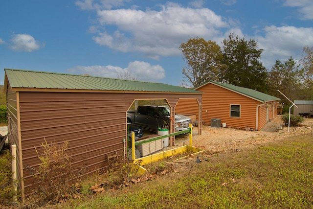 view of property exterior with a carport and cooling unit