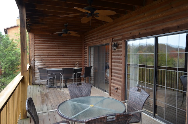 wooden terrace featuring ceiling fan