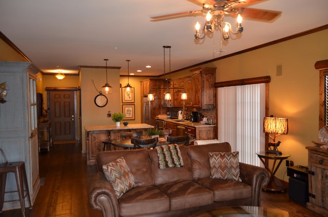 living room with dark hardwood / wood-style flooring, ceiling fan, and crown molding