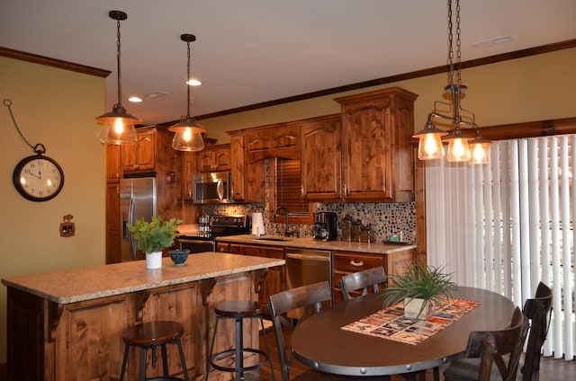 24 Village Trl Unit 1, Branson, MO 65616 - kitchen featuring appliances with stainless steel finishes, a sink, a center island, decorative backsplash, and ornamental molding