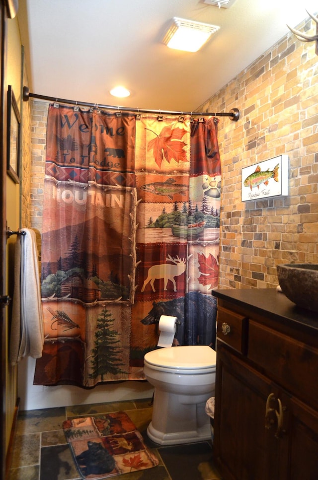24 Village Trl Unit 1, Branson, MO 65616 - full bath with toilet, a shower with shower curtain, vanity, and brick wall