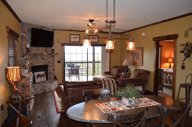 24 Village Trl Unit 1, Branson, MO 65616 - dining room with crown molding, ceiling fan, hardwood / wood-style flooring, and a fireplace