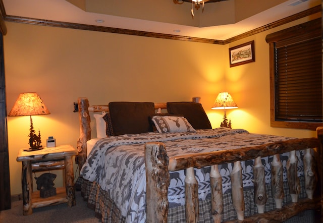 carpeted bedroom featuring crown molding