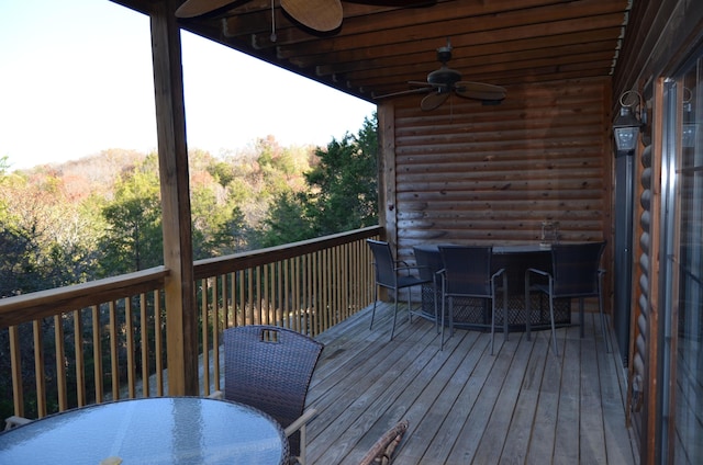 24 Village Trl Unit 1, Branson, MO 65616 - wooden deck with outdoor dining area and ceiling fan