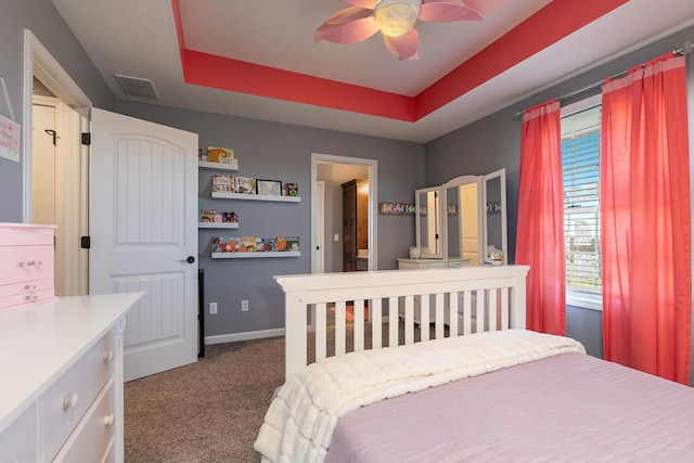 1558 E 432nd Rd, Bolivar, MO 65613 - carpeted bedroom with a tray ceiling and ceiling fan