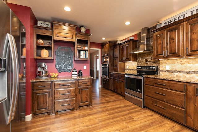 1558 E 432nd Rd, Bolivar, MO 65613 - kitchen featuring stainless steel appliances, wall chimney exhaust hood, open shelves, light wood-style flooring, and recessed lighting