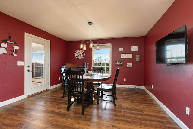 1558 E 432nd Rd, Bolivar, MO 65613 - dining area featuring a chandelier and wood finished floors