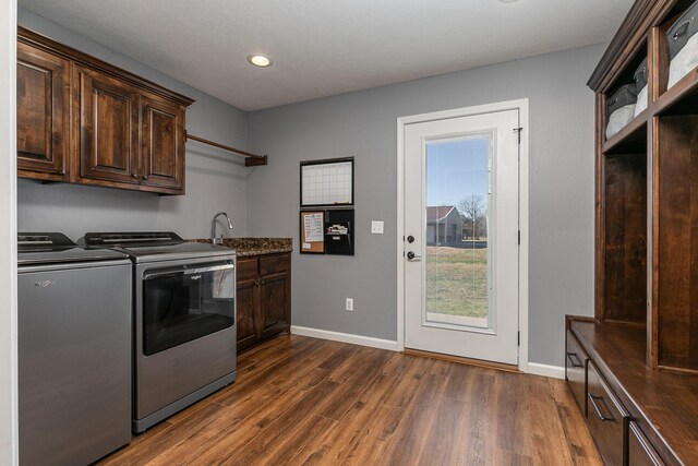 1558 E 432nd Rd, Bolivar, MO 65613 - laundry room featuring washer and clothes dryer, cabinet space, dark wood-style flooring, and recessed lighting