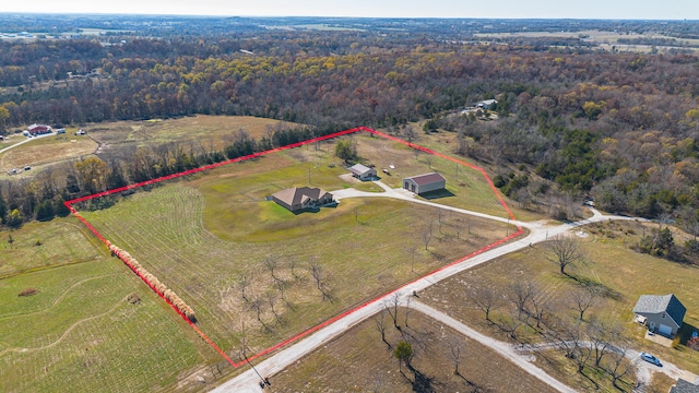 birds eye view of property featuring a rural view