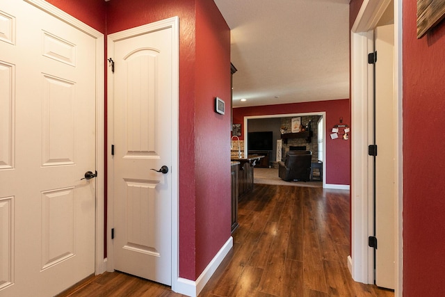 1558 E 432nd Rd, Bolivar, MO 65613 - hallway with dark wood finished floors and baseboards