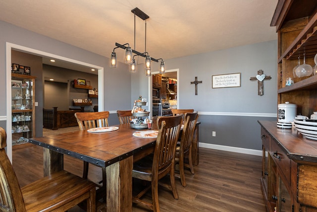 dining area featuring dark hardwood / wood-style flooring