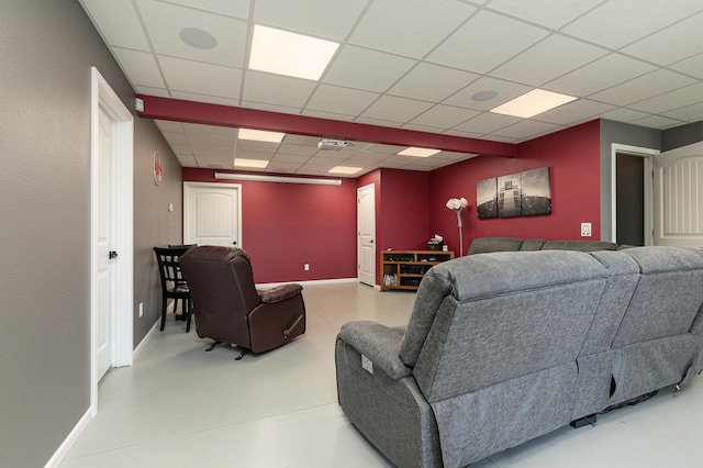 living room featuring a paneled ceiling