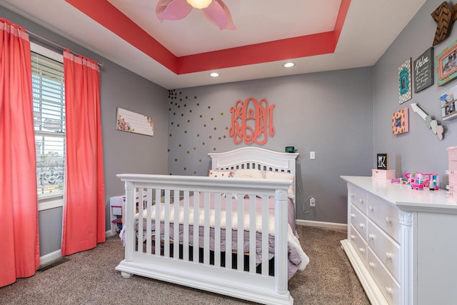 1558 E 432nd Rd, Bolivar, MO 65613 - carpeted bedroom featuring recessed lighting, a nursery area, a raised ceiling, and a ceiling fan