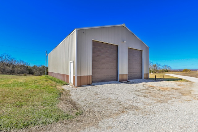 garage with a yard