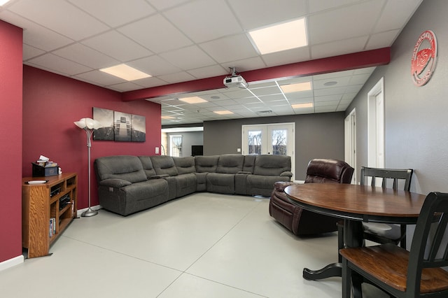 living room with a drop ceiling