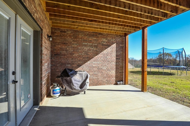 1558 E 432nd Rd, Bolivar, MO 65613 - view of patio with a trampoline, area for grilling, and a mountain view