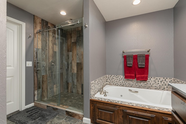 bathroom featuring independent shower and bath and vanity