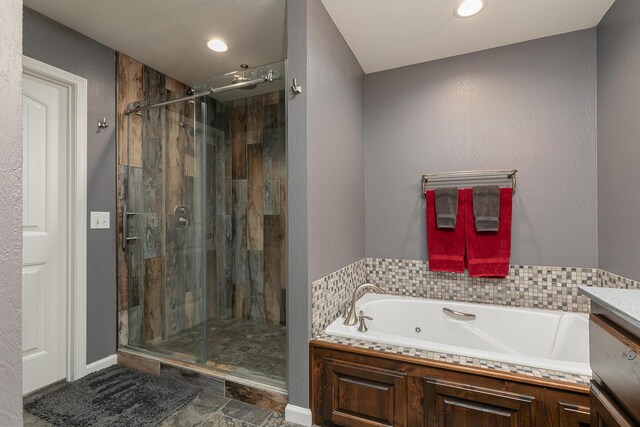 1558 E 432nd Rd, Bolivar, MO 65613 - full bath with a jetted tub, a stall shower, vanity, and recessed lighting