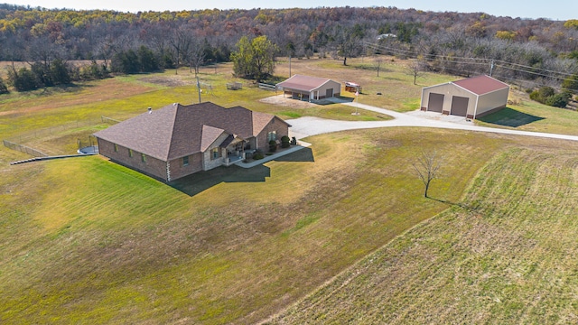 birds eye view of property with a rural view