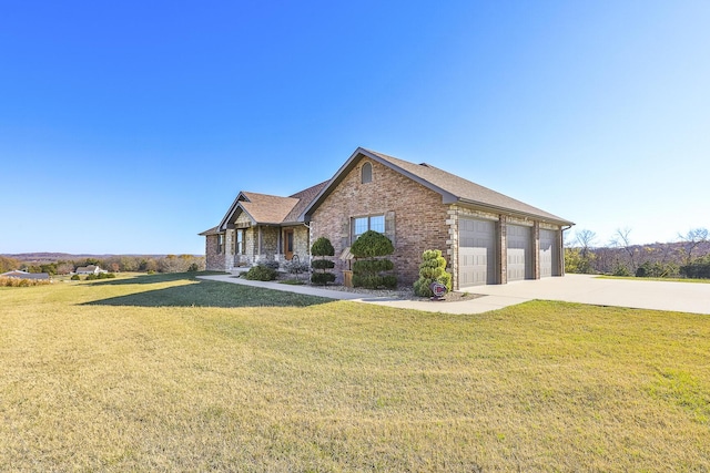 1558 E 432nd Rd, Bolivar, MO 65613 - view of front facade featuring brick siding, a front lawn, concrete driveway, and a garage