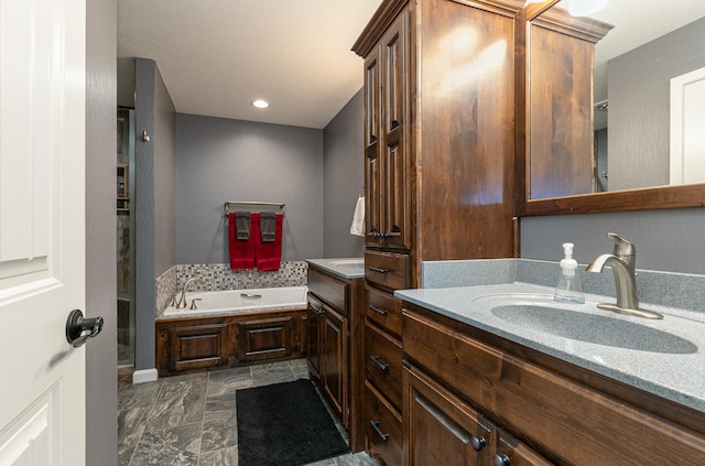 bathroom featuring a bathing tub and vanity