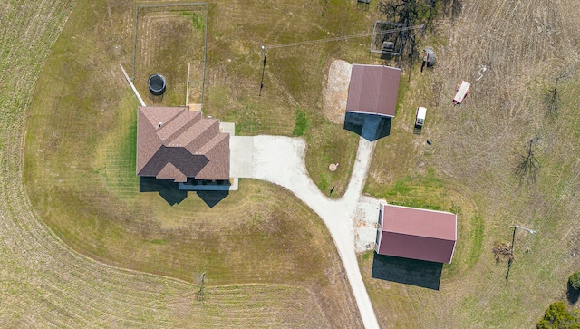 birds eye view of property with a rural view