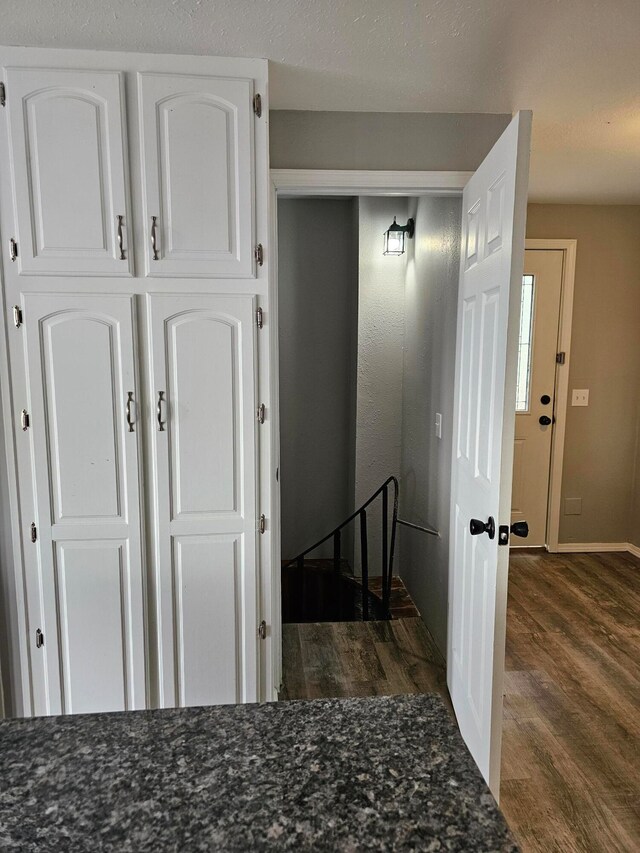 hallway featuring dark wood-type flooring