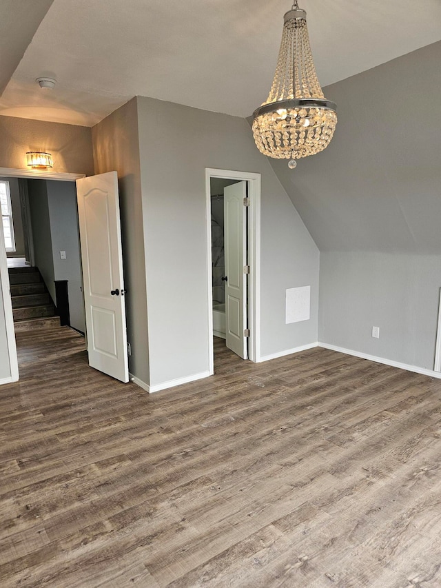 interior space featuring vaulted ceiling and hardwood / wood-style flooring