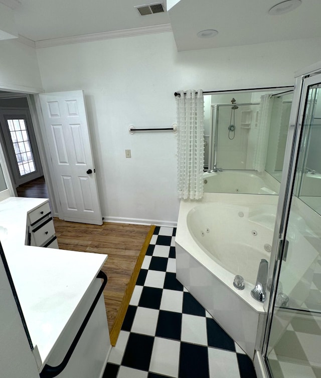 bathroom featuring vanity, hardwood / wood-style flooring, crown molding, and independent shower and bath