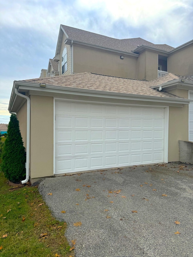 view of side of home featuring a garage