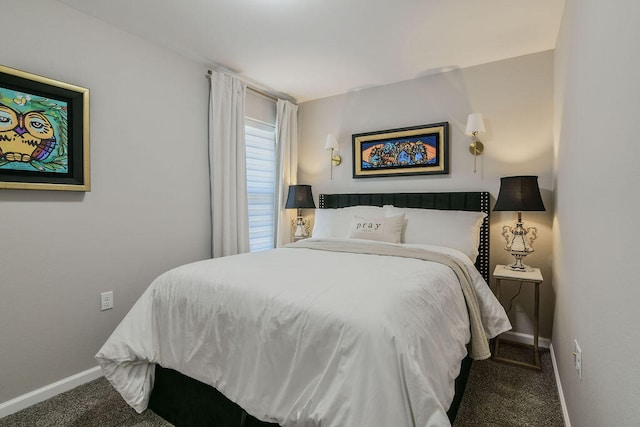 bedroom featuring dark carpet