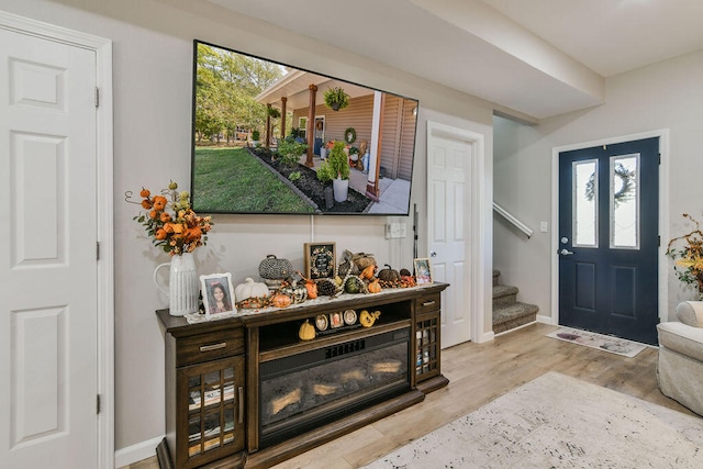 entryway with light hardwood / wood-style floors